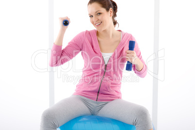 Fitness woman exercise dumbbell ball gym