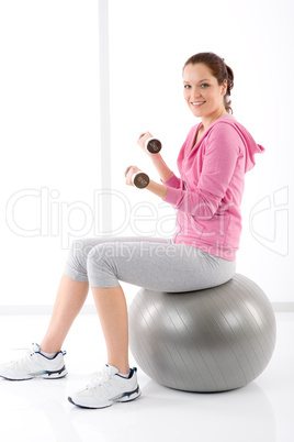 Fitness woman exercise dumbbell ball gym