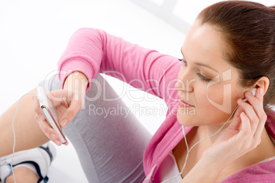 Fitness woman listen music mp3 relax