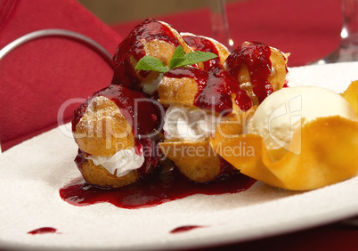 Tasty profiteroles on a dining table
