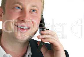 The businessman speaks by phone. Conducts conversation.