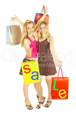 Two girls with bags - comparison shopping. Sale!