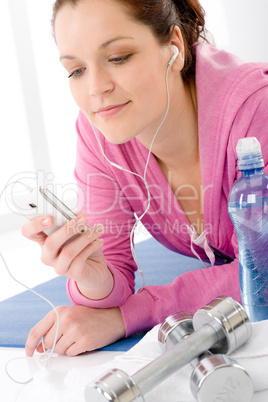 Fitness woman listen music mp3 relax gym