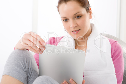 Woman touch screen computer fitness outfit