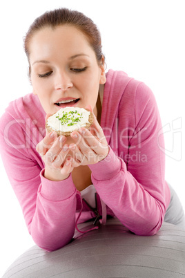 Fitness woman eat snack sportive outfit