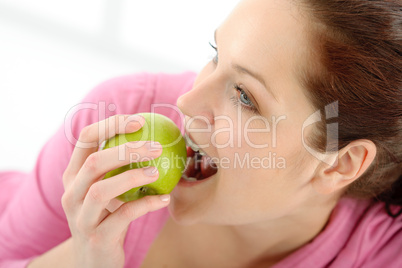 Fitness woman eat apple sportive outfit