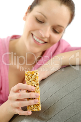 Fitness woman eat granola sportive outfit happy