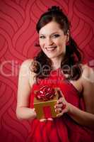 Cocktail party woman hold present evening dress