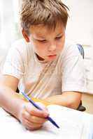 boy behind a desk