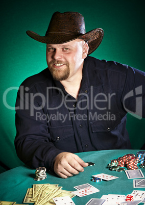 man with a beard plays poker