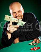 man with a beard plays poker