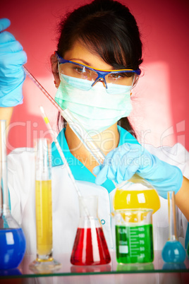 scientist in laboratory with test tubes