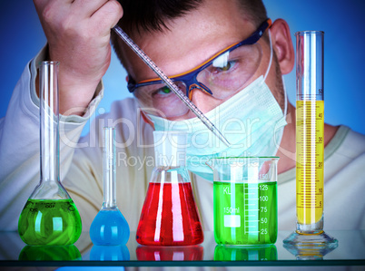 scientist in laboratory with test tubes