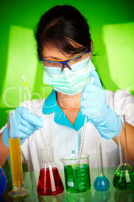 scientist in laboratory with test tubes