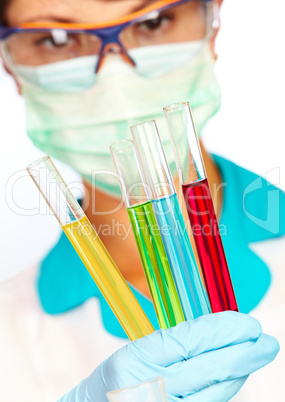 scientist in laboratory with test tubes