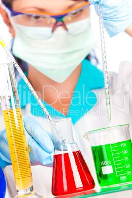 scientist in laboratory with test tubes