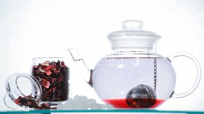 Woman preparing red Hibiscus tea