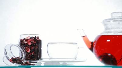 Woman take  red Hibiscus tea