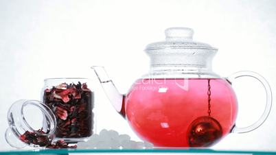 Woman preparing red Hibiscus tea