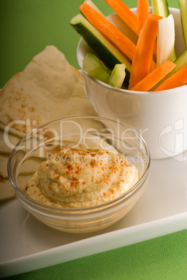 hummus dip with pita bread and vegetable