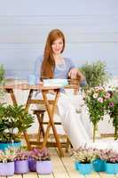 Summer terrace redhead woman relax in garden