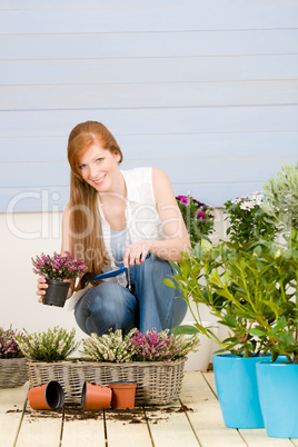 Summer garden terrace redhead woman hold flower