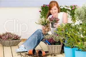 Summer garden terrace redhead woman hold flower