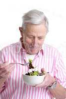 Senior man with healthy salad
