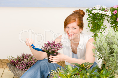 Summer garden terrace redhead woman potted flower