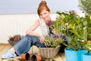 Summer garden terrace redhead woman potted flower