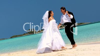 Wedding Couple Laughing & Dancing on the Beach