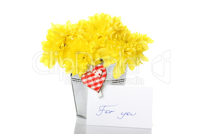 Yellow chrysanthemums in a pail