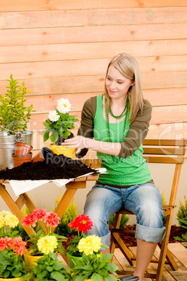 Gardening woman planting spring flower