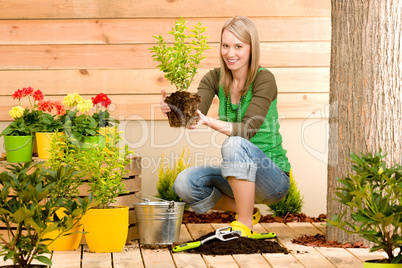 Gardening woman planting on terrace