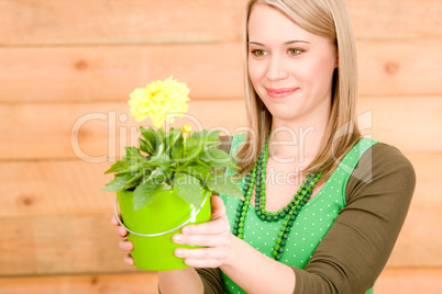 Portrait happy woman hold yellow flower spring