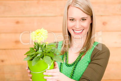 Portrait happy woman hold yellow flower spring