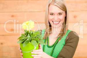 Portrait happy woman hold yellow flower spring