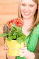 Portrait happy woman hold potted flower spring