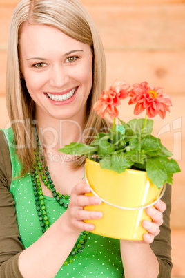 Portrait happy woman hold potted flower spring