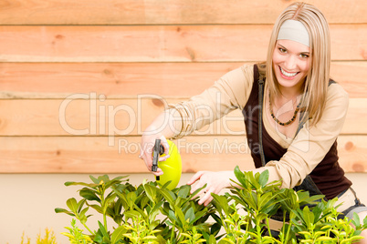Gardening woman watering plants in spring