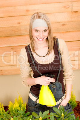 Gardening woman watering plants in spring