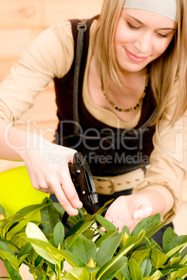 Gardening woman watering plants in spring