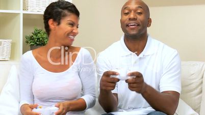 African American Couple Playing on Games Console