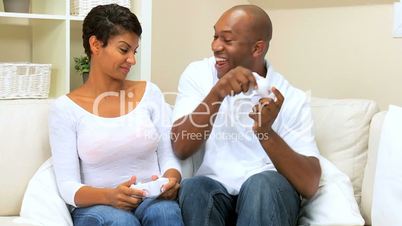 Ethnic Couple Playing with Games Console