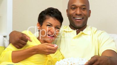 Couple Relaxing With a Movie & Popcorn