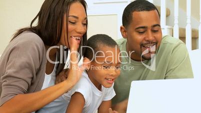 African American Family Using Internet Webchat