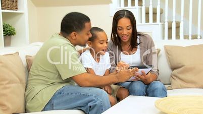Ethnic Family Using Wireless Tablet Technology