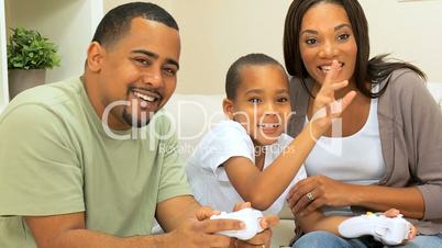 Ethnic Family Playing on Games Console