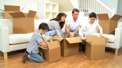 Young Family Unpacking in New Home