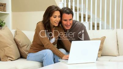 Young Couple Using Laptop Internet Webchat